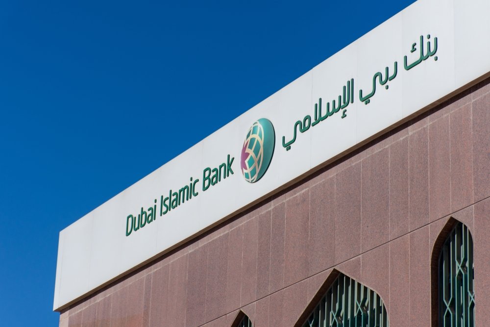 &quot;Ras al Khaimah, Ras al Khaimah/United Arab Emirates - 12/23/2019: &quot;Dubai Islamic Bank a major Middle Eastern banks building sign logo on large building top on a sunny day. &quot;