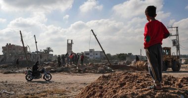 A Palestinian boy checks the site of an airstrike in Deir al Balah, in the central Gaza Strip, May 3, 2023. (AFP Photo)