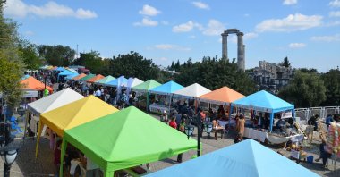 Visitors walk among food stands at Vegfest festival, in Didim, Türkiye, April 19, 2019. (Shutterstock Photo)