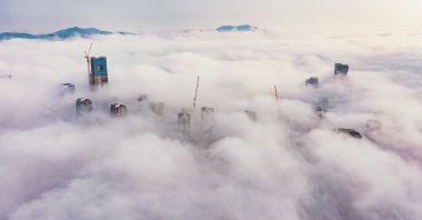 An aerial view shows fog enveloping construction sites in Sejong, South Korea. (Getty Images Photo)