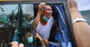 Prisoners being released are pictured in a bus outside the Insein prison in Yangon, Myanmar, May 3, 2023. (AFP Photo)