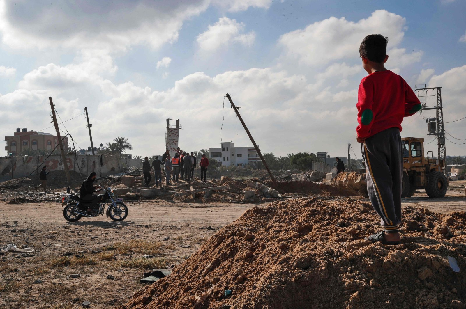A Palestinian boy checks the site of an airstrike in Deir al Balah, in the central Gaza Strip, May 3, 2023. (AFP Photo)