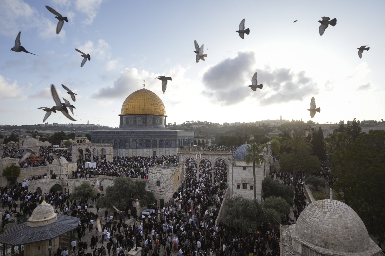 Palestinians attend Eid al-Fitr holiday celebrations by the Dome of the Rock shrine in the Al-Aqsa Mosque compound in Jerusalem&#039;s Old City, April 21, 2023. (AP Photo)