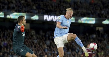 West Ham United goalkeeper Lukasz Fabianski (L) and Manchester City's Erling Haaland in action during an English Premier League match at Etihad stadium in Manchester, U.K., May 3, 2023. (AP Photo)