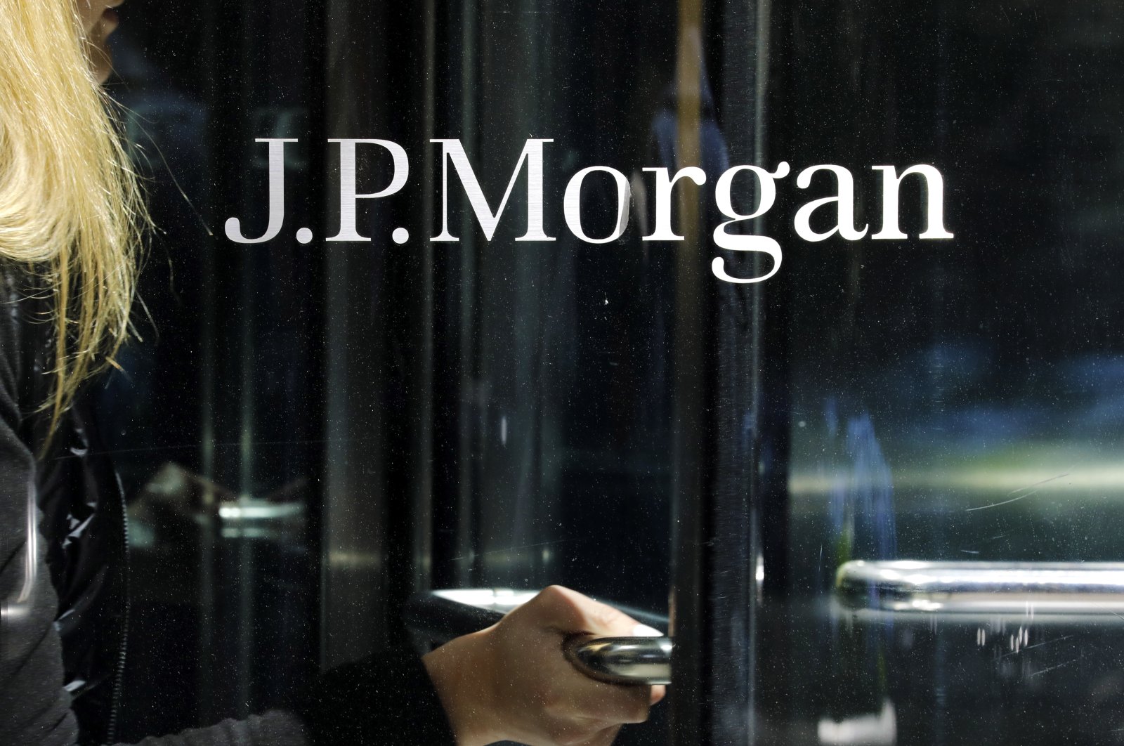 A woman exits JPMorgan Chase headquarters on Park Avenue in New York, New York, U.S., May 1, 2023. (EPA Photo)