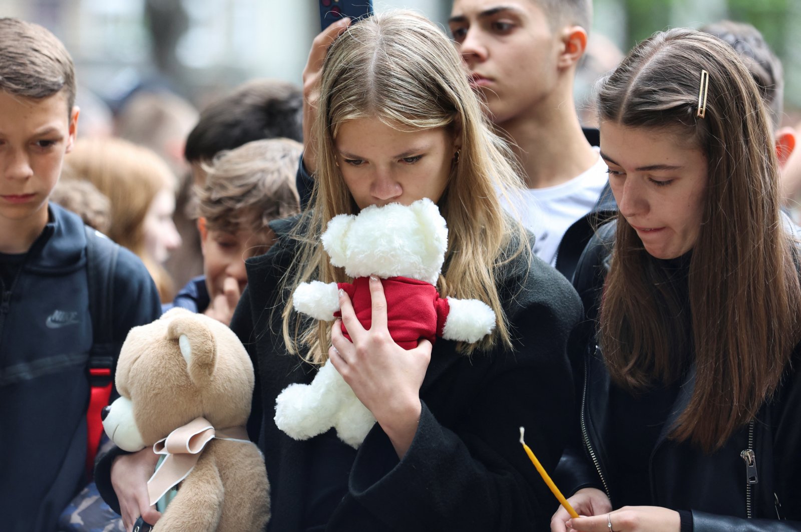 People react as they pay tribute following a school mass shooting in Belgrade, Serbia, May 4, 2023. (Reuters Photo)
