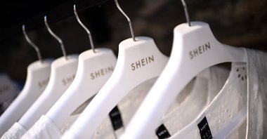 Clothes are displayed on hangers at a Chinese fashion brand Shein pop-up store in Paris, France, May 4, 2023. (AFP Photo)