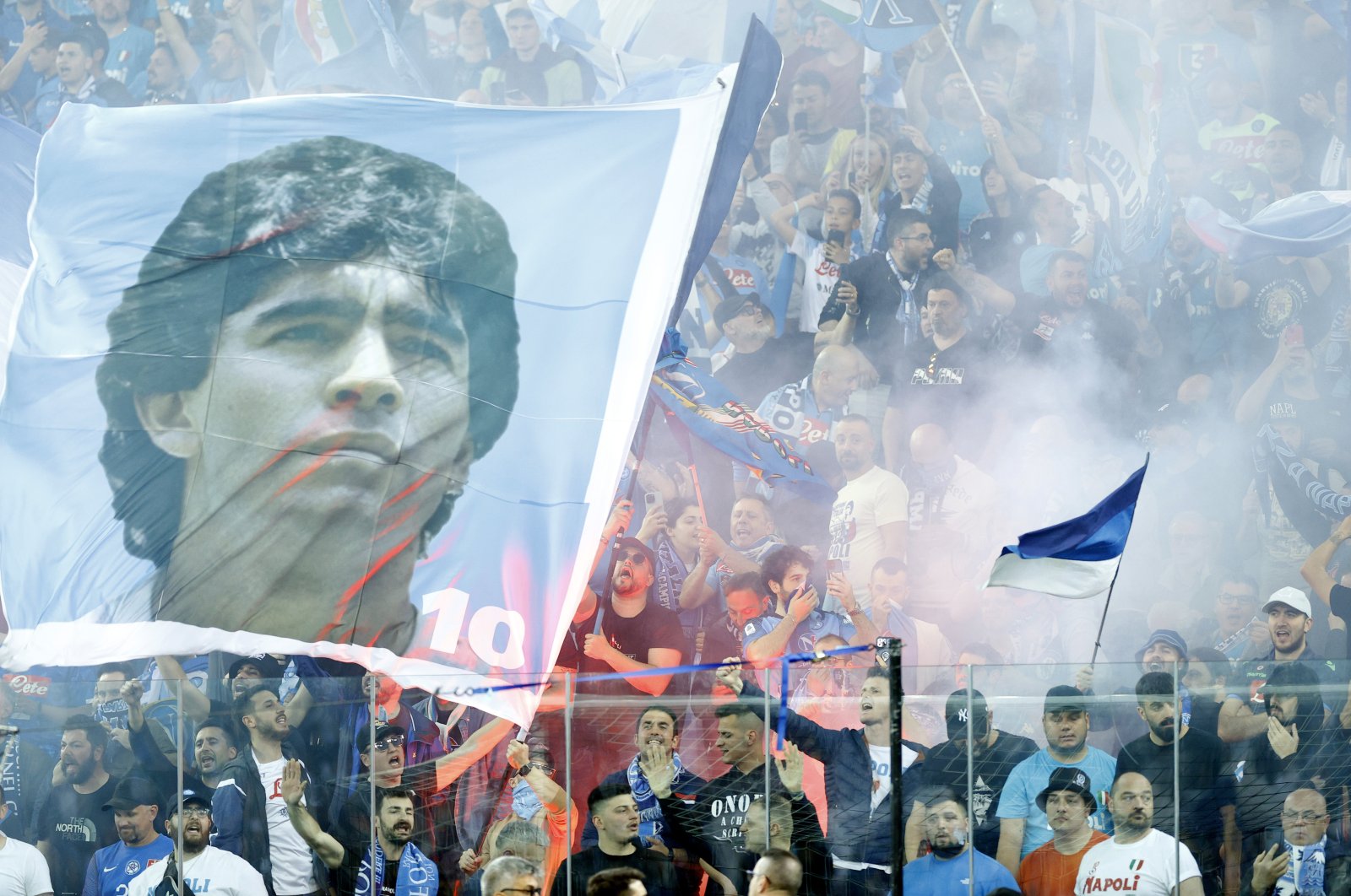Napoli fans raise a banner with Diego Maradona&#039;s face during the Serie A match between Udinese Calcio and SSC Napoli at Dacia Arena, Udine, Italy, May 4, 2023. (Getty Images Photo)