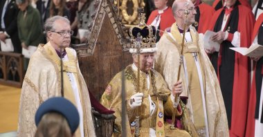 King Charles III sits as he was crowned with Saint Edward&#039;s Crown by the Archbishop of Canterbury during the coronation ceremony at Westminster Abbey, London, U.K., May 6, 2023. (AP Photo)