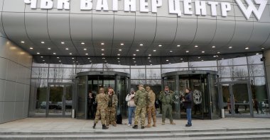 People gather outside PMC Wagner Centre, which is a project implemented by the businessman and founder of the Wagner private military group Yevgeny Prigozhin, during the official opening of the office block in Saint Petersburg, Russia, Nov. 4, 2022. (Reuters File Photo)