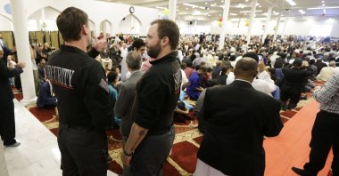 Private security officers stand guard at left during a prayer service at the Muslim Association of Puget Sound Redmond Mosque, Wednesday, July 6, 2016, in Redmond, Wash. (AP File Photo)