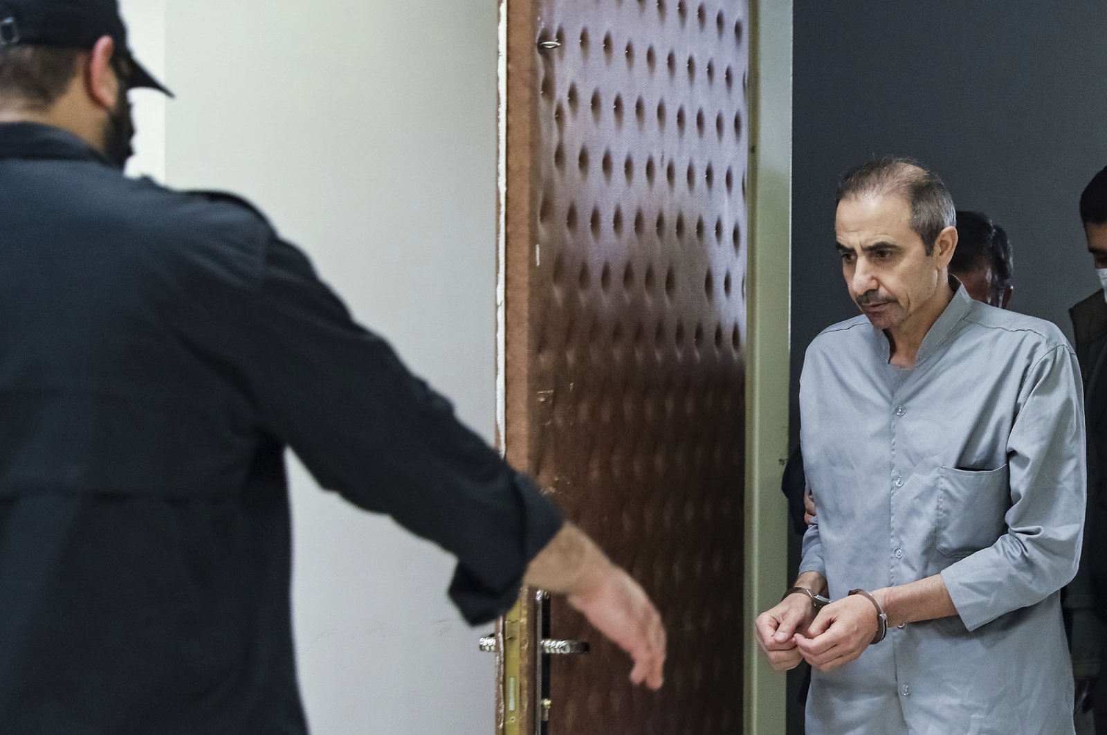 Iranian-Swedish dual national Farajollah Chaab arrives at a courtroom at the Revolutionary Court in Tehran, Iran, Oct. 25, 2022. (AP Photo)