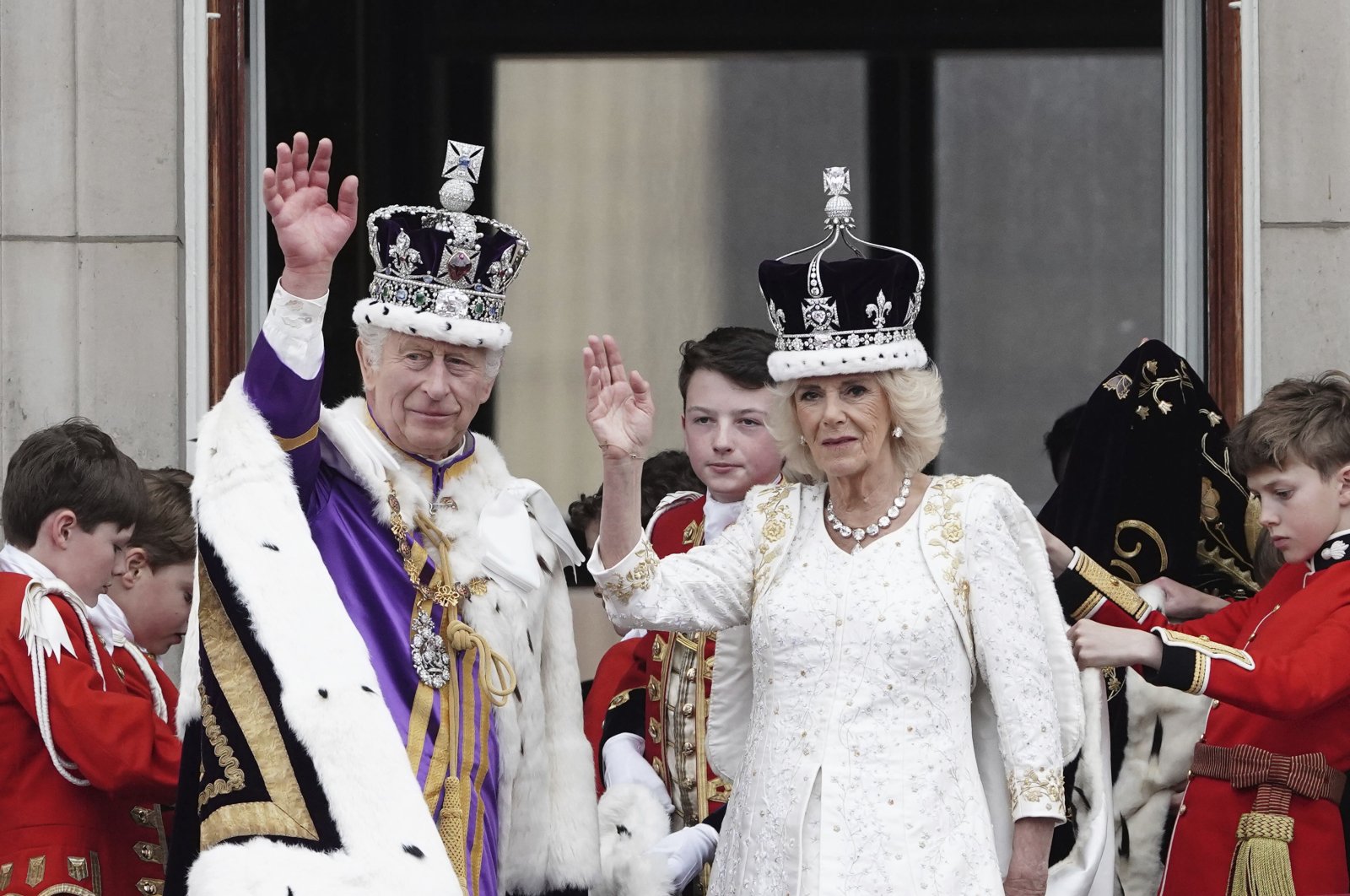 Britain&#039;s King Charles III and Queen Camilla wave on the balcony of Buckingham Palace, in London, following the coronation, Saturday, May 6, 2023. (AP Photo)