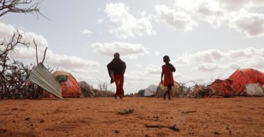 Civilians walk at the Kaxareey camp for the internally displaced people in Dollow, Gedo region of Somalia, May 24, 2022. (Reuters Photo)