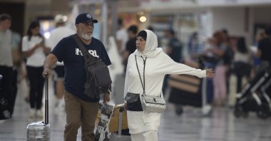 Tourists walk through an airport in the Mediterranean tourism hot spot Antalya, southern Türkiye, Sept. 21, 2022. (AA Photo)