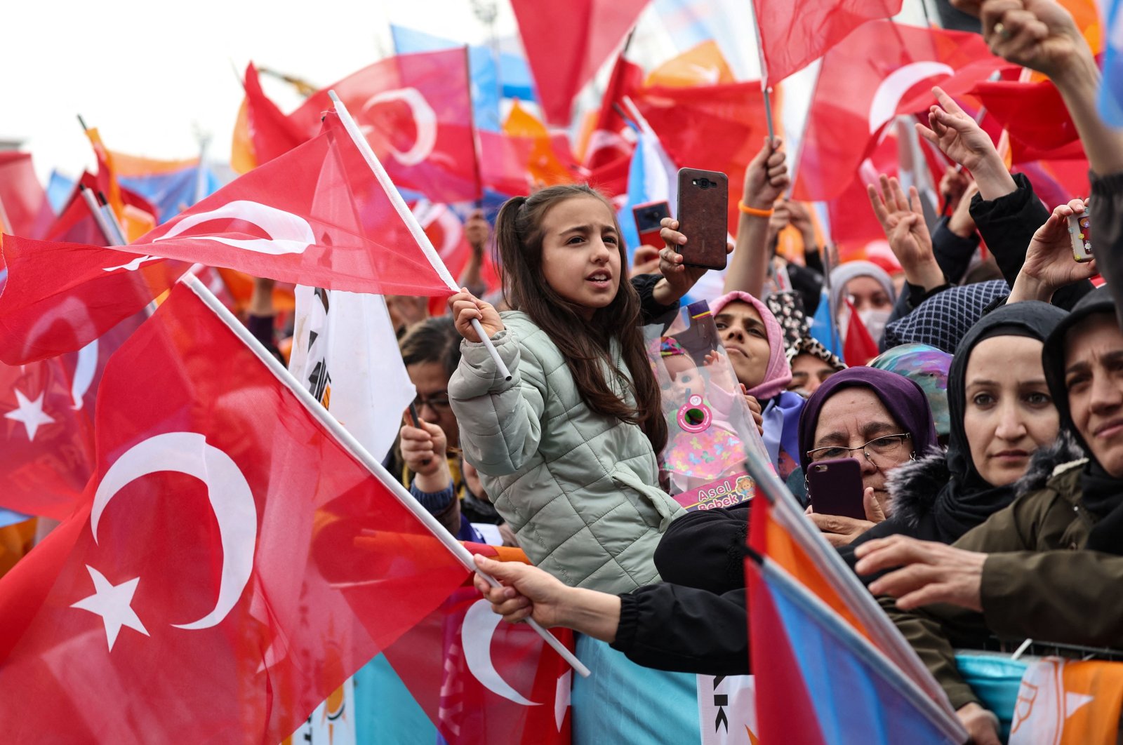 Supporters of President Recep Tayyip Erdoğan wave Turkish flags and cheer during his election campaign rally in Ankara, Türkiye, April 30, 2023. (AFP Photo)