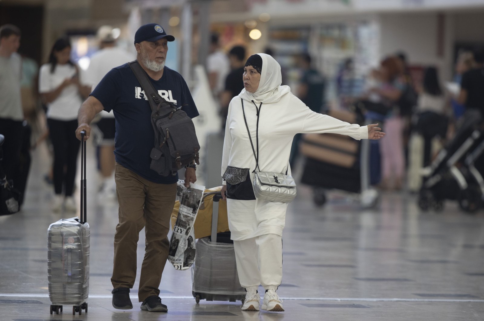 Tourists walk through an airport in the Mediterranean tourism hot spot Antalya, southern Türkiye, Sept. 21, 2022. (AA Photo)