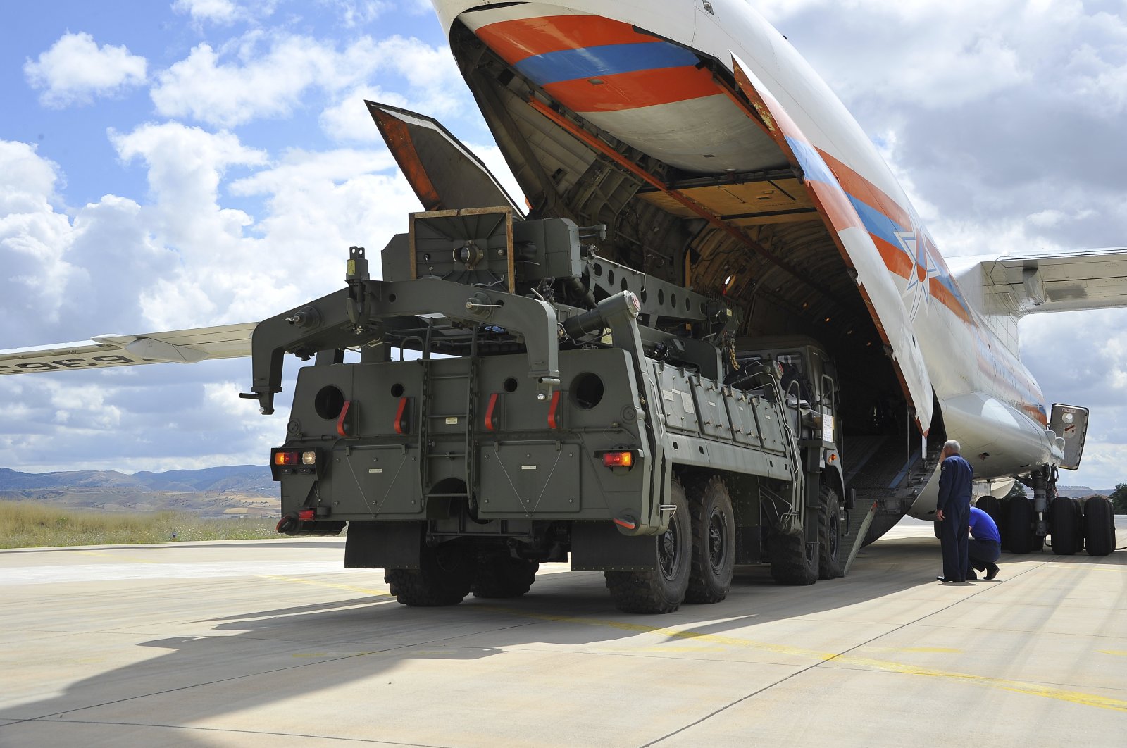 Military vehicles and equipment, parts of the S-400 air defense systems, are unloaded from a Russian transport aircraft, at Mürted military airport in Ankara, Türkiye, July 12, 2019. (AP Photo)