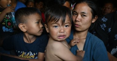 People are evacuated by the Indian army to a temporary shelter as they flee ethnic violence in Manipur, northeastern Indian, May 7, 2023. (AFP Photo)