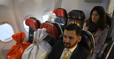Two diplomatic couriers accompany bags carrying votes for the Turkish elections intended for Istanbul after voting ended in Madrid, Spain, May 8, 2023. (AA Photo)