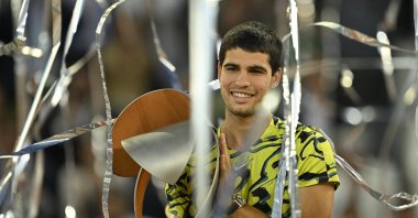 Spain&#039;s Carlos Alcaraz poses for pictures with the trophy after winning the 2023 ATP Tour Madrid Open tennis tournament singles final match against Germany&#039;s Jan-Lennard Struff at Caja Magica, Madrid, Spain, May 7, 2023. (AA Photo)