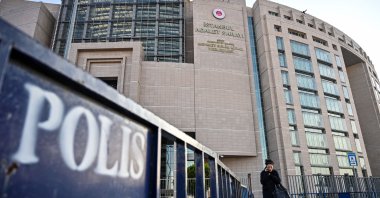 A woman walks in front of the courthouse in Istanbul, Türkiye, Dec. 11, 2019. (AFP Photo)