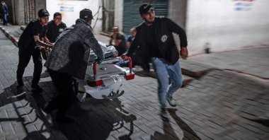 Men carry the body of a victim killed in an Israeli airstrike, Gaza City, Palestinian Territories, May 9, 2023. (AFP Photo)