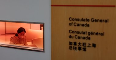 A woman sits in an office in the Consulate General of Canada, in Shanghai, China, May 9, 2023. (EPA Photo)