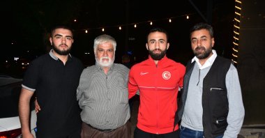 Turkish wrestler Burhan Akbudak (2nd R), who won the gold medal at the European Wrestling Championship held in Croatia, stands with the family of his wrestler friend who lost his life in the earthquake, Kahramanmaraş, Türkiye, May 8, 2023. (AA Photo)