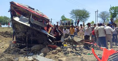 Onlookers gather at the site of a bus accident in Khargone district of Madhya Pradesh, India, May 9, 2023. (AFP Photo)
