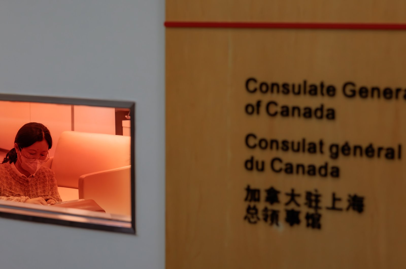 A woman sits in an office in the Consulate General of Canada, in Shanghai, China, May 9, 2023. (EPA Photo)