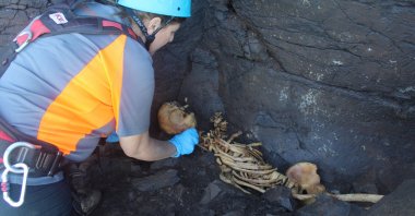 Archaeologist Veronica Alberto from Tibicena, an archaeology company, works on the extraction of human remains, in Galdar, on the island of Gran Canaria, Spain, March 9, 2023. (Reuters Photo)