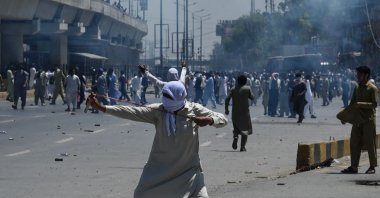 Pakistan Tehreek-e-Insaf (PTI) party activists and supporters of former Prime Minister Imran Khan clash with police in Peshawar, Pakistan, May 10, 2023. (AFP Photo)
