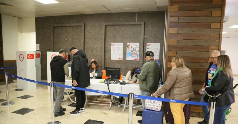 People cast their votes at Antalya Airport customs for the May 14 elections, Türkiye, April 27, 2023. (DHA Photo)