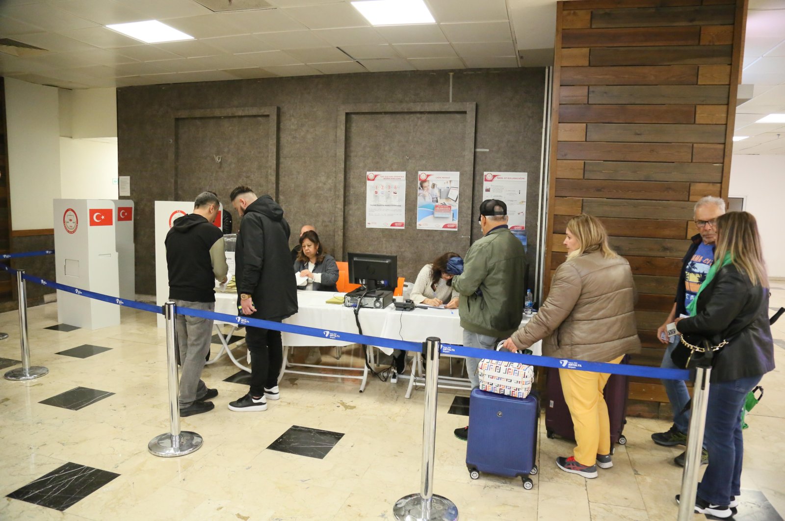 People cast their votes at Antalya Airport customs for the May 14 elections, Türkiye, April 27, 2023. (DHA Photo)
