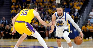 Golden State Warriors' Stephen Curry (R) drives past Los Angeles Lakers' Austin Reaves during the fourth quarter in Game 5 of the Western Conference Semifinal playoffs at Chase Center, San Francisco, U.S., May 10, 2023. (AFP Photo)