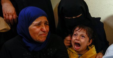 A child reacts as mourners attend the funeral of a Palestinian killed in an Israeli strike, Khan Younis, southern Gaza Strip, Palestine, May 11, 2023. (Reuters Photo)