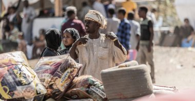 Refugees who crossed from Sudan to Ethiopia put their belongings for security check in Metema, Ethiopia, May 4, 2023. (AFP Photo)