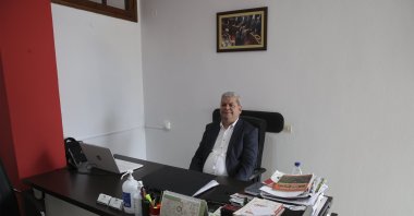 SYRIZA lawmaker Hüseyin Zeybek speaks to Anadolu Agency reporter in an interview, May 11, 2023. (AA Photo)