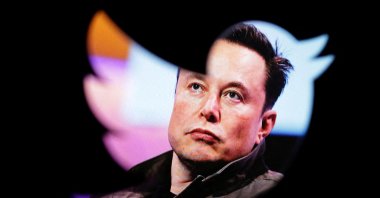 Elon Musk&#039;s photo is seen through a Twitter logo in this illustration dated Oct. 28, 2022. (Reuters Photo)