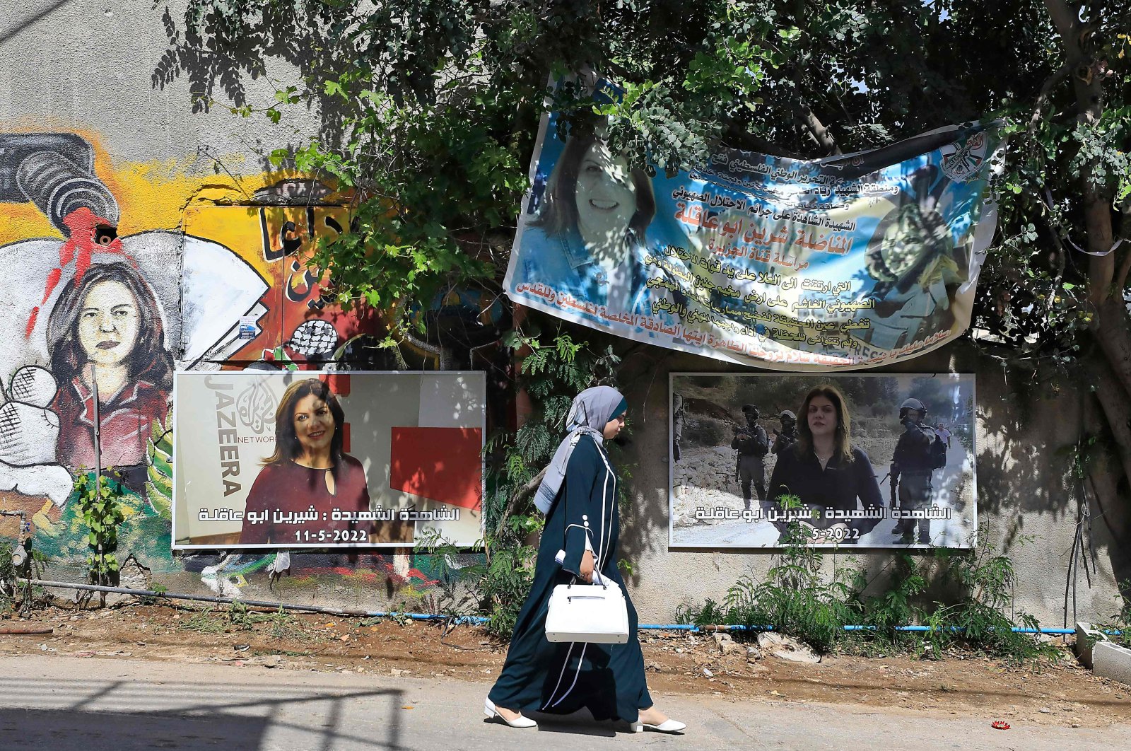 A woman walks past the spot where Al-Jazeera journalist Shireen Abu Akleh was killed, Jenin, occupied West Bank, Palestine, May 11, 2023. (AFP Photo)