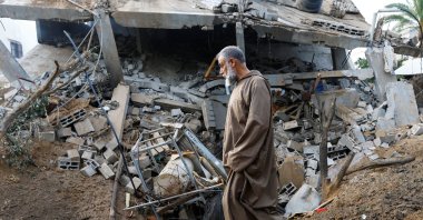 A man walks at the site of an Israeli airstrike amid Israel-Gaza fighting in Deir al-Balah town in the central Gaza Strip, Palestine, May 12, 2023. (Reuters Photo)
