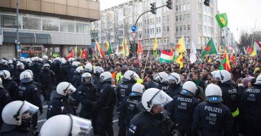 Police officers stop a pro-PKK mass demonstration in Cologne, western Germany, Jan. 27, 2018. (AFP)