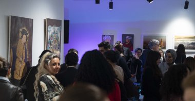Visitors look at artwork as part of the "Phoenix" exhibition at The Old Street Gallery, in London, U.K., May 11, 2023. (AA Photo)