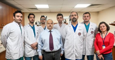 Professor Dr. Şükrü Çağlar (L-3) and Associate Dr. Ümit Eroğlu (R-3) are photographed with their team in Ankara, Türkiye, May 12, 2023. (AA Photo)