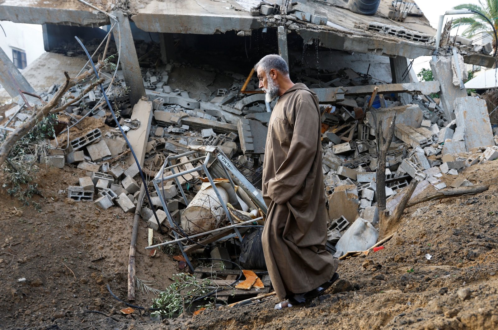 A man walks at the site of an Israeli airstrike amid Israel-Gaza fighting in Deir al-Balah town in the central Gaza Strip, Palestine, May 12, 2023. (Reuters Photo)