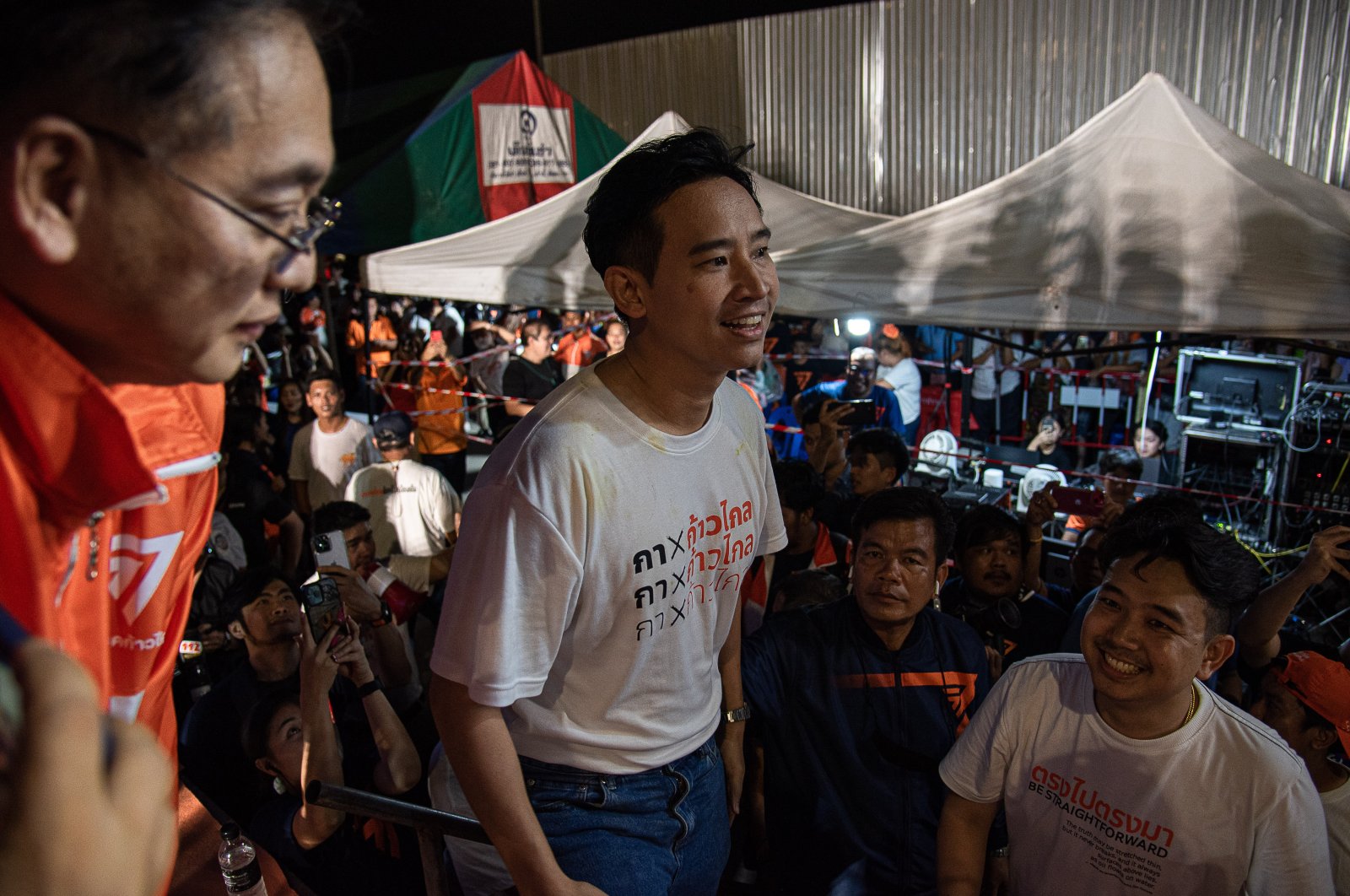 Pita Limjaroenrat (C), the Move Forward Party and candidate for prime minister in the upcoming general election during the pre-election campaign at Samut Prakarn, Thailand, May 5, 2023. (Getty Images Photo)