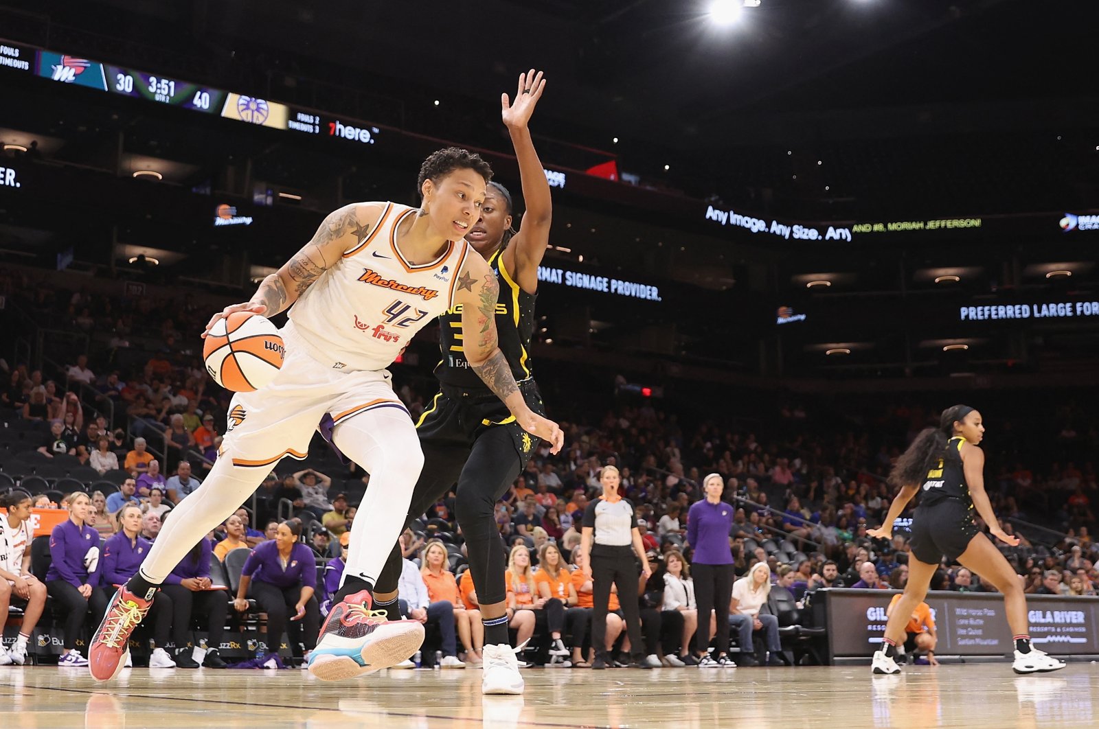 Phoenix Mercury&#039;s Brittney Griner (L) drives the ball against the Los Angeles Sparks during the first half of the WNBA game at Footprint Center, Phoenix, US., May 12, 2023. (AFP Photo)