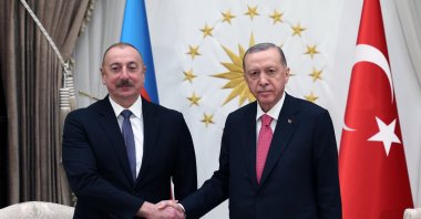 President Recep Tayyip Erdoğan shakes hands with Azerbaijan's President Ilham Aliyev (R) in the capital Ankara, Türkiye, March 15, 2023. (AA Photo)
