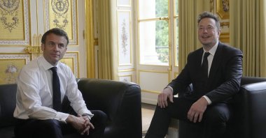 Twitter, now X. Corp, and Tesla CEO Elon Musk (R) poses with French President Emmanuel Macron before their talks, at the Elysee Palace in Paris, France, May 15, 2023. (EPA Photo)